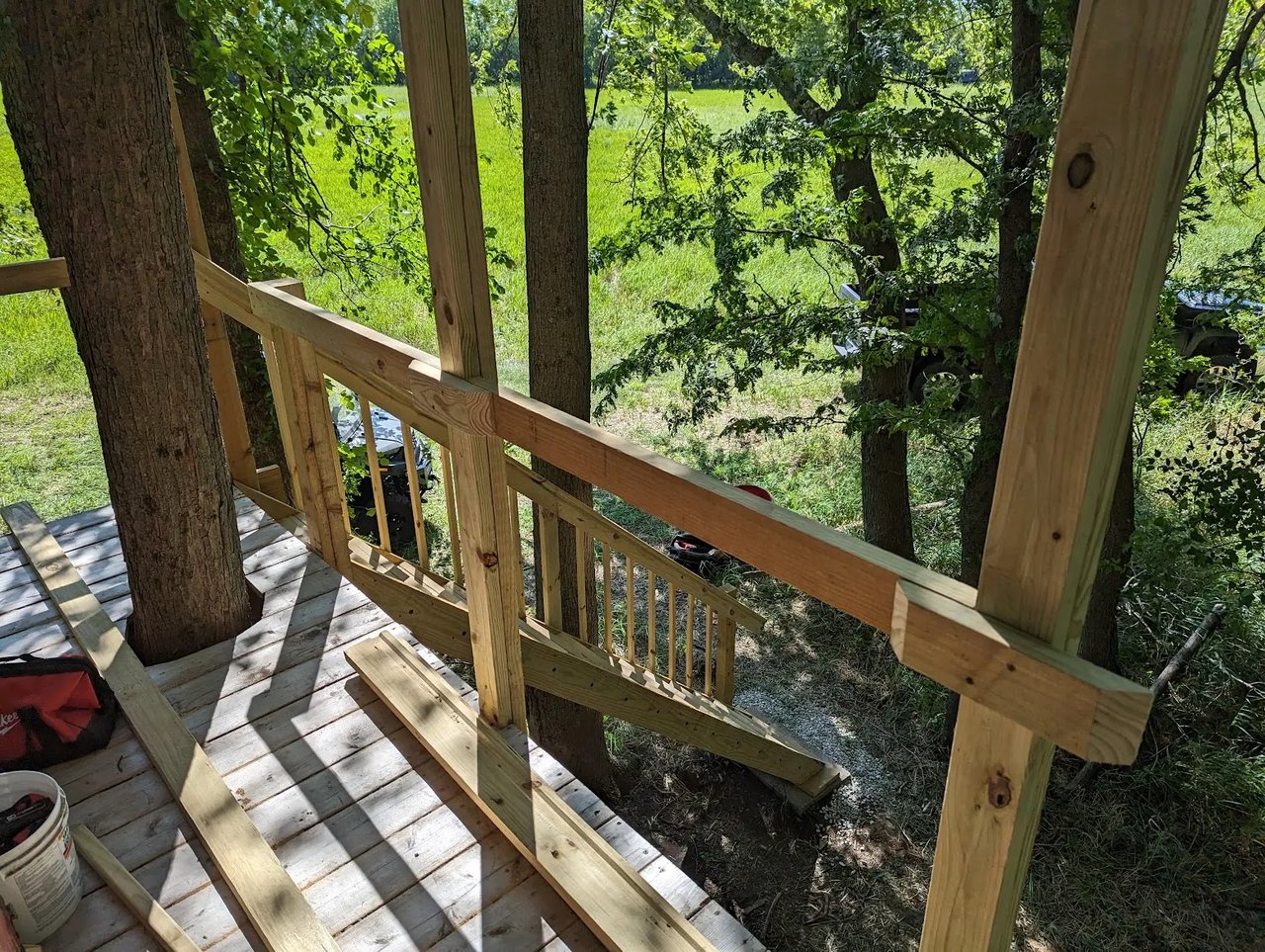 Railings begin to take form, integrating with the awning supports