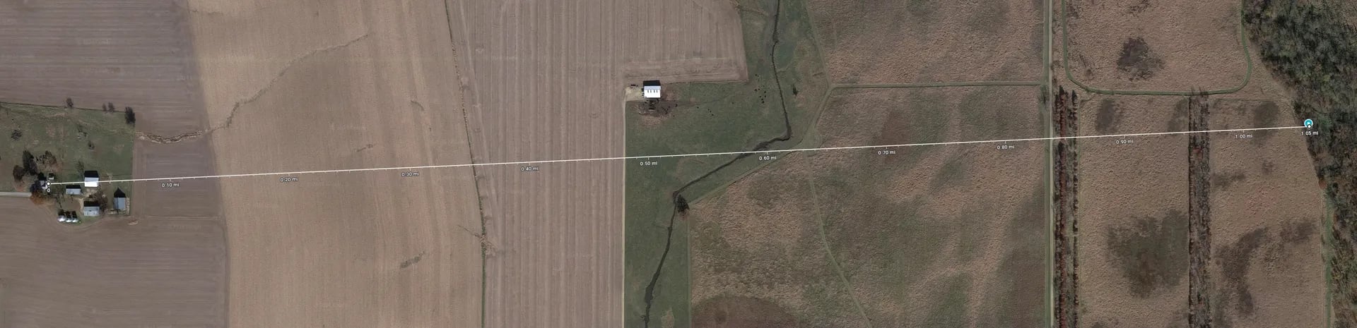 Google Maps satellite image showing a distance of 1.05mi from the farmhouse to the treehouse