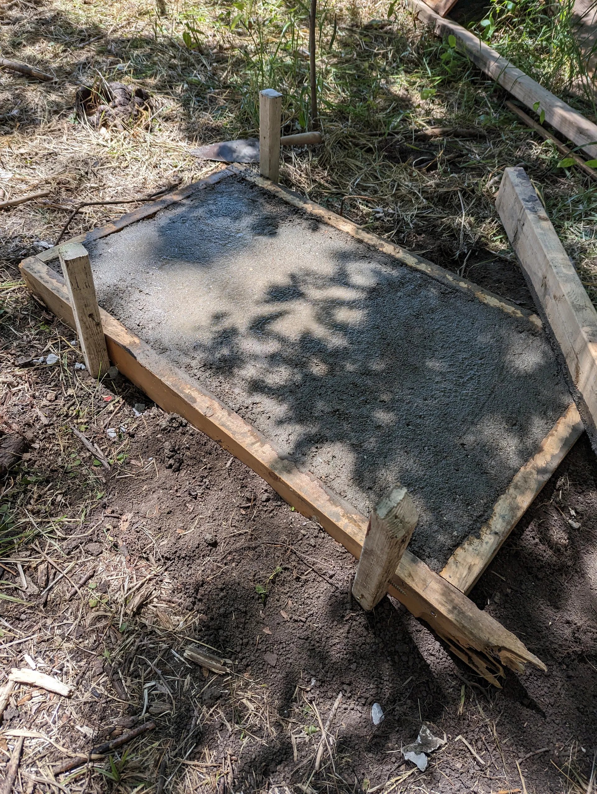 Concrete poured into frame and leveled off