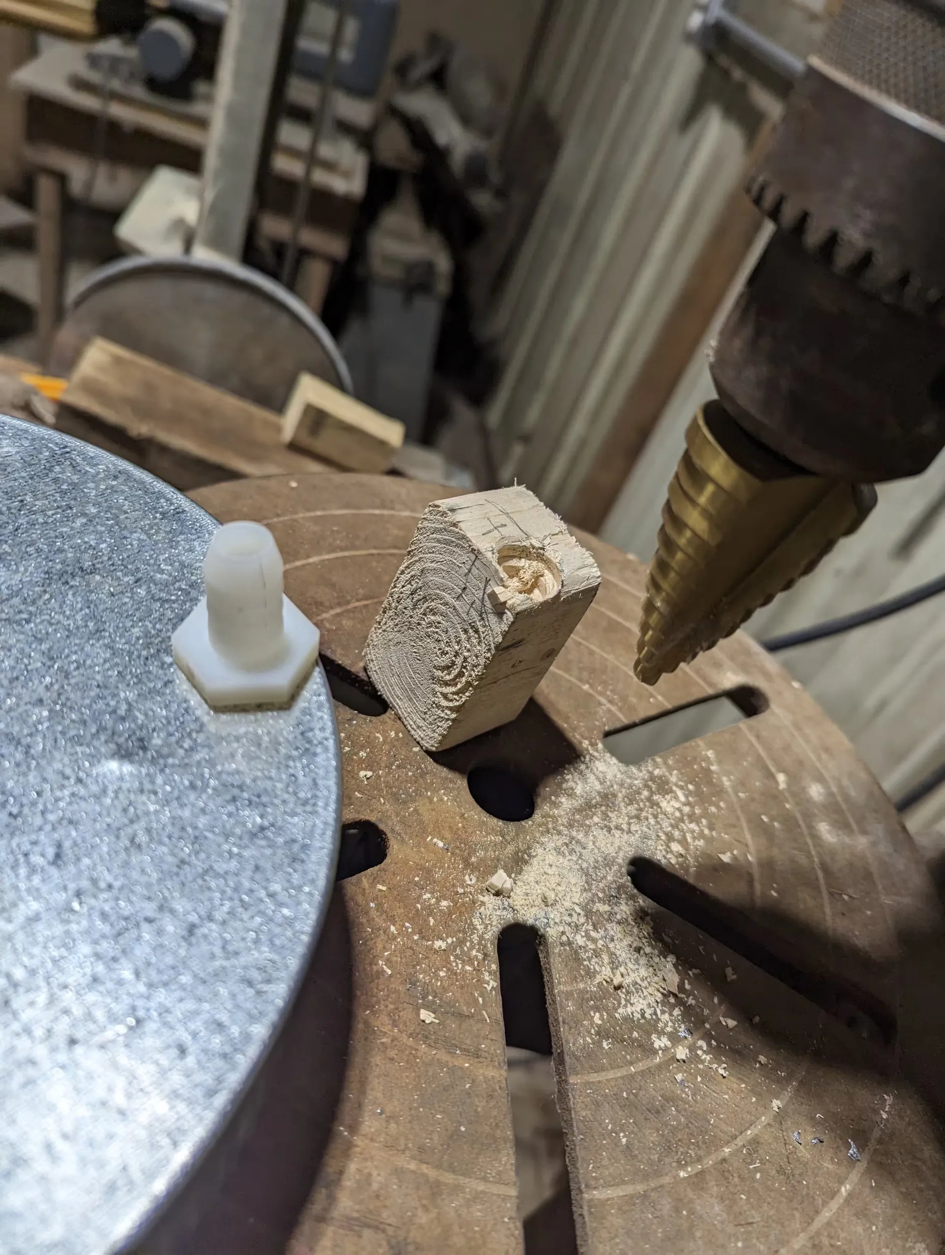 Drilling holes in the cap for the steam inlet and drain