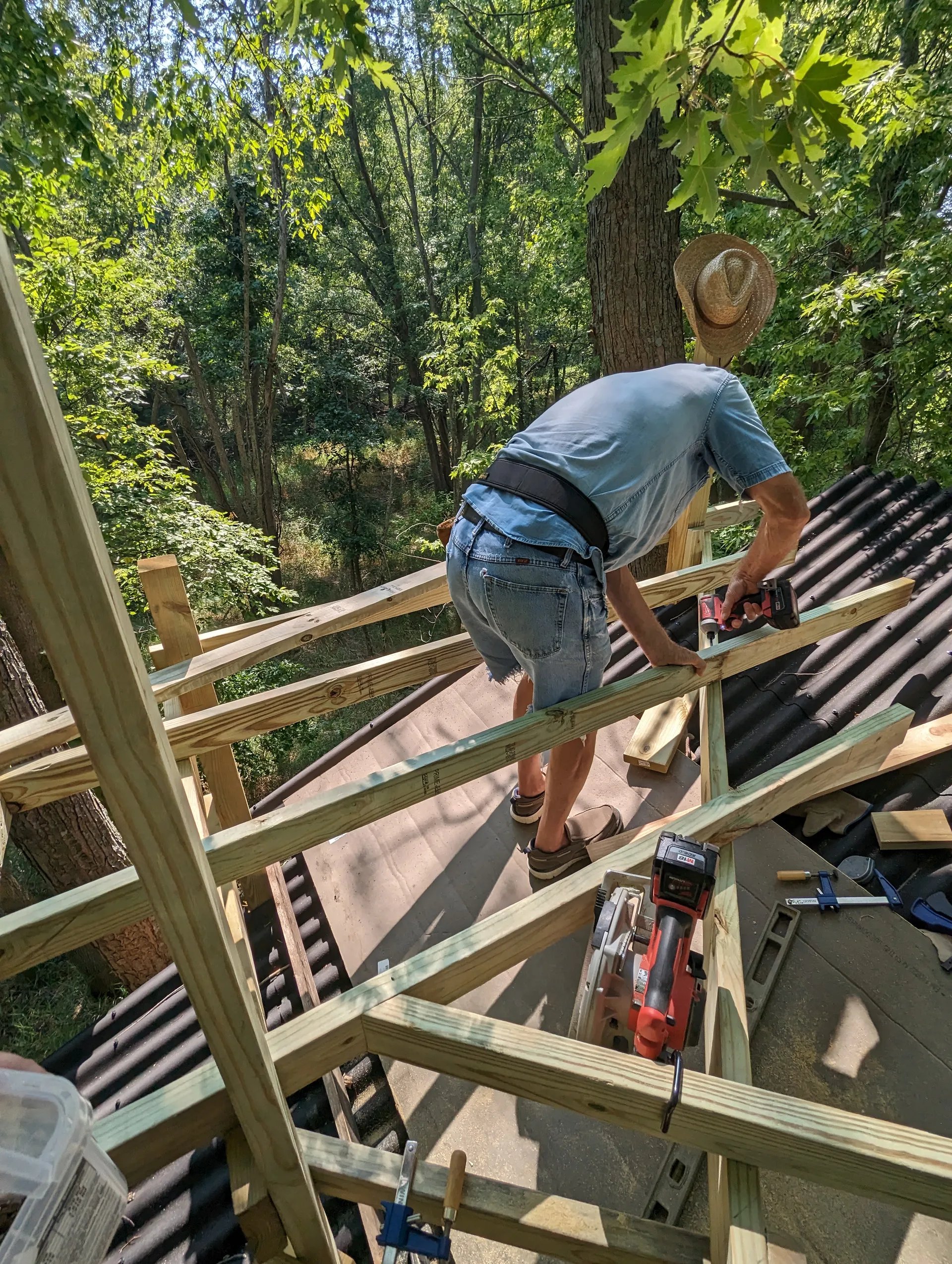 Dad screwing in the floor joists