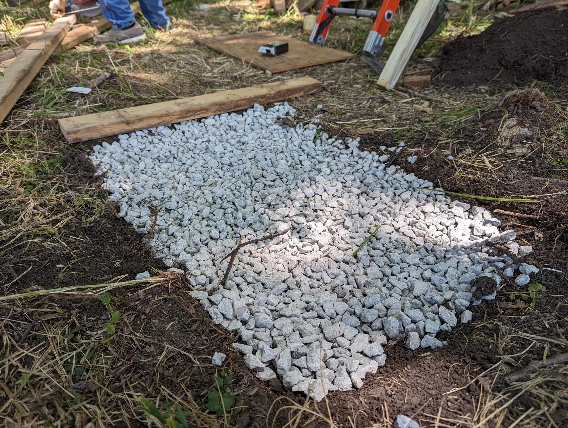 Rectangular area cleared and covered in a thin layer of gravel