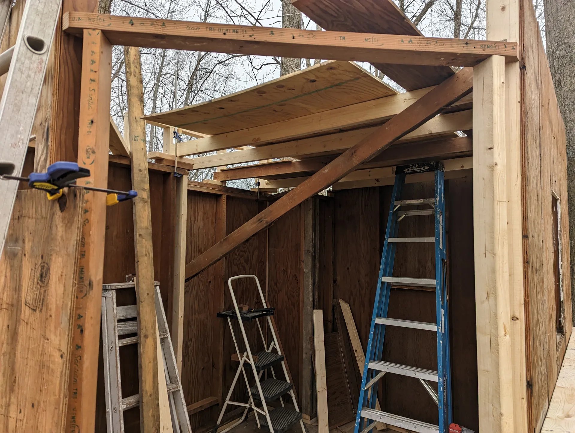 Joists for the loft partially up with plywood resting atop