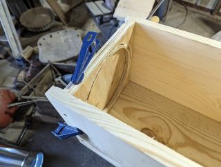Door end of the box with a routed edge around the hole
