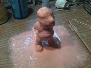 Building up rubber layers on the main figurine